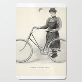"Leading a Bicycle About" from "Bicycling for Ladies" by Maria E. Ward, 1896 Cutting Board