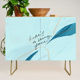 "Here's To Being Free." Credenza