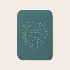 "Through Sun And Rain, You Will Bloom All The Same." Bath Mat