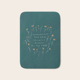 "Through Sun And Rain, You Will Bloom All The Same." Bath Mat