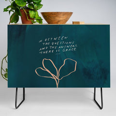 "In Between The Questions And The Answers, There Is Grace." Credenza