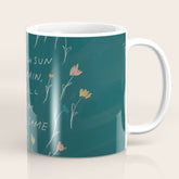"Through Sun And Rain, You Will Bloom All The Same." Coffee Mug