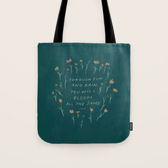 "Through Sun And Rain, You Will Bloom All The Same." Tote Bag