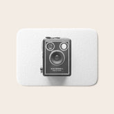 A Kodak Brownie analog vintage camera on a white background Retro photography in black and white Bath Mat