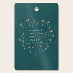 "Through Sun And Rain, You Will Bloom All The Same." Cutting Board