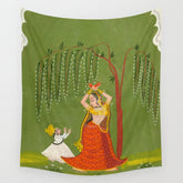 A female attendant is standing in tribhanga pose under a tree. A small child vies for her attention. Wall Tapestry