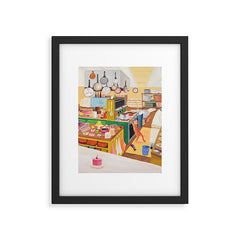 A Cat in the Kitchen Framed Art Print