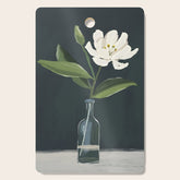 A flower in a vase Cutting Board