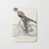 "Dismounting Over the Wheel" from "Bicycling for Ladies" by Maria E. Ward, 1896 Bath Mat