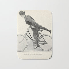 "Dismounting Over the Wheel" from "Bicycling for Ladies" by Maria E. Ward, 1896 Bath Mat