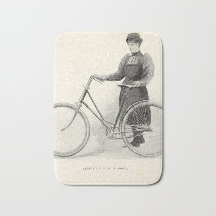 "Leading a Bicycle About" from "Bicycling for Ladies" by Maria E. Ward, 1896 Bath Mat
