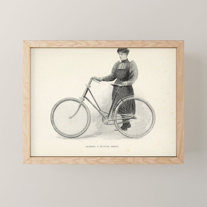 "Leading a Bicycle About" from "Bicycling for Ladies" by Maria E. Ward, 1896 Mini Art Print