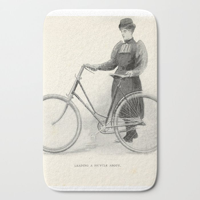 "Leading a Bicycle About" from "Bicycling for Ladies" by Maria E. Ward, 1896 Bath Mat