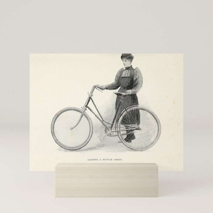 "Leading a Bicycle About" from "Bicycling for Ladies" by Maria E. Ward, 1896 Mini Art Print
