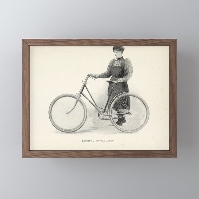 "Leading a Bicycle About" from "Bicycling for Ladies" by Maria E. Ward, 1896 Mini Art Print