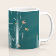 "Through Sun And Rain, You Will Bloom All The Same." Coffee Mug