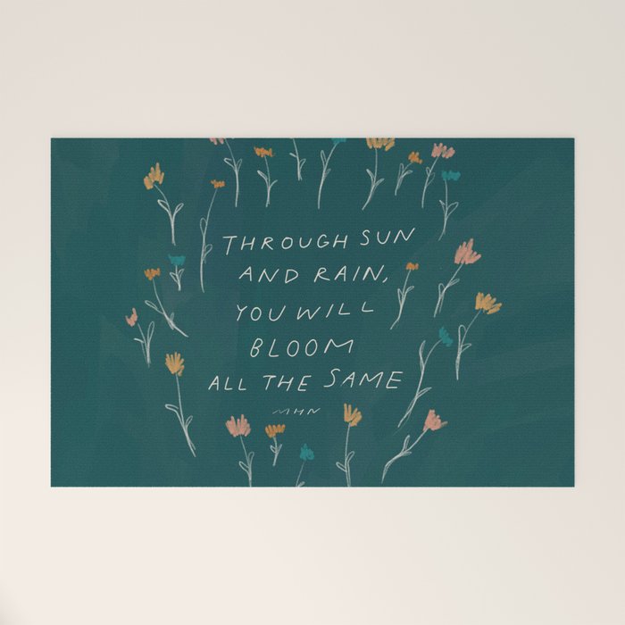 "Through Sun And Rain, You Will Bloom All The Same." Welcome Mat