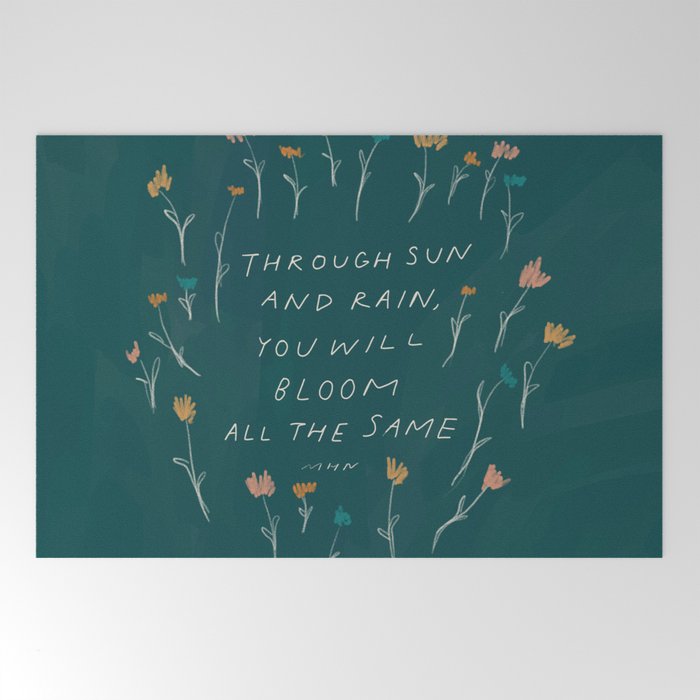 "Through Sun And Rain, You Will Bloom All The Same." Welcome Mat