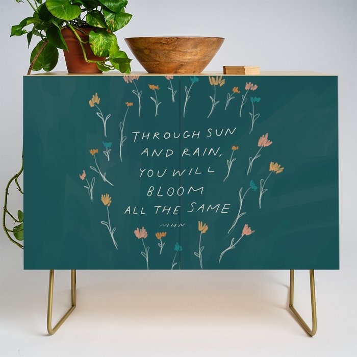 "Through Sun And Rain, You Will Bloom All The Same." Credenza