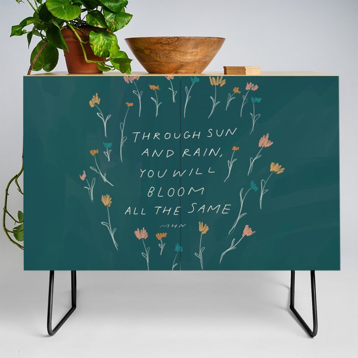 "Through Sun And Rain, You Will Bloom All The Same." Credenza