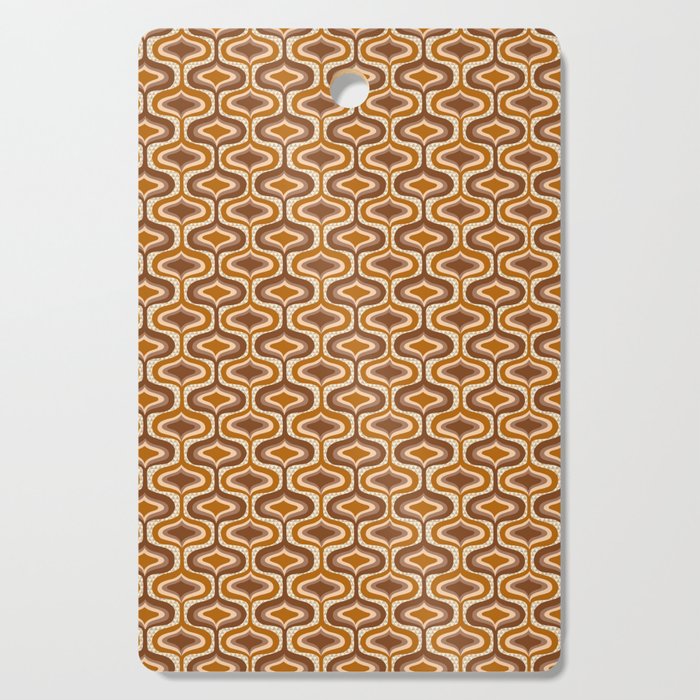 70s mod fabric repeat, orange and browns Cutting Board