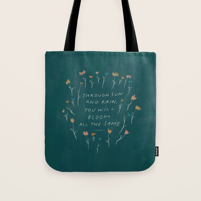 "Through Sun And Rain, You Will Bloom All The Same." Tote Bag