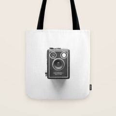 A Kodak Brownie analog vintage camera on a white background  Retro photography in black and white Tote Bag