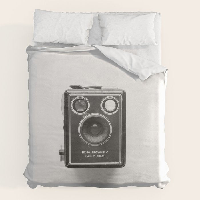 A Kodak Brownie analog vintage camera on a white background  Retro photography in black and white Duvet Cover