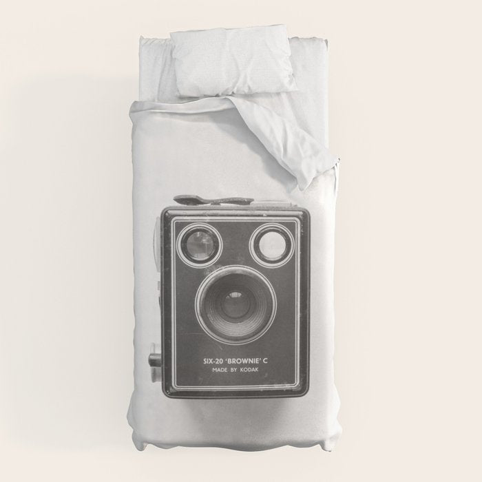 A Kodak Brownie analog vintage camera on a white background  Retro photography in black and white Duvet Cover
