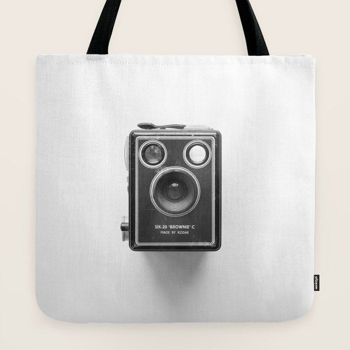 A Kodak Brownie analog vintage camera on a white background  Retro photography in black and white Tote Bag
