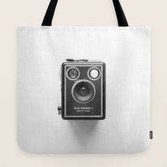 A Kodak Brownie analog vintage camera on a white background  Retro photography in black and white Tote Bag