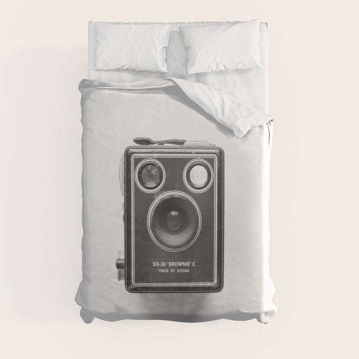 A Kodak Brownie analog vintage camera on a white background  Retro photography in black and white Duvet Cover