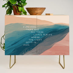 "Even Here, There Are All These Little Places Where The Light Gets In." Credenza