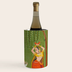 A female attendant is standing in tribhanga pose under a tree. A small child vies for her attention. Wine Chiller