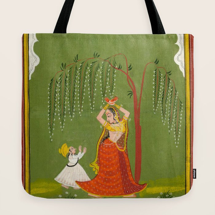 A female attendant is standing in tribhanga pose under a tree. A small child vies for her attention. Tote Bag