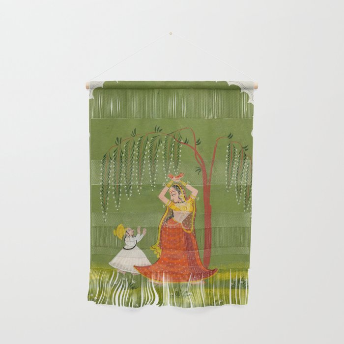 A female attendant is standing in tribhanga pose under a tree. A small child vies for her attention. Wall Hanging