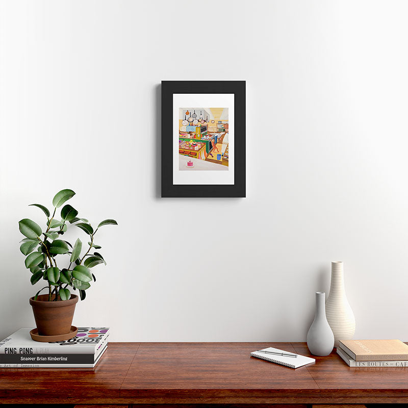 A Cat in the Kitchen Framed Art Print