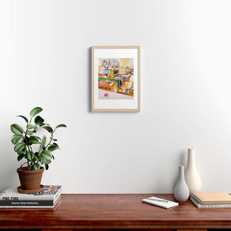 A Cat in the Kitchen Framed Art Print