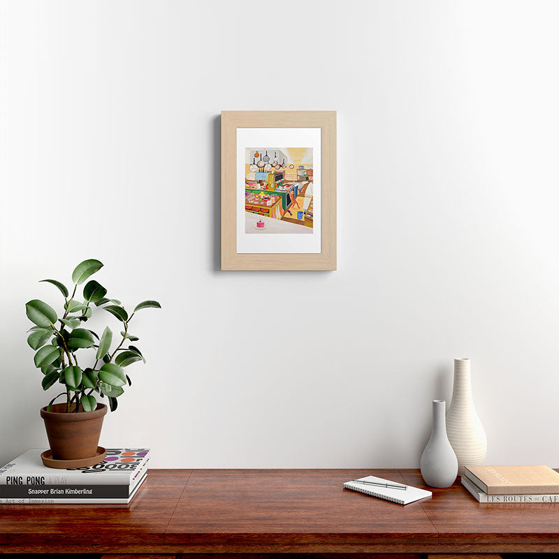 A Cat in the Kitchen Framed Art Print