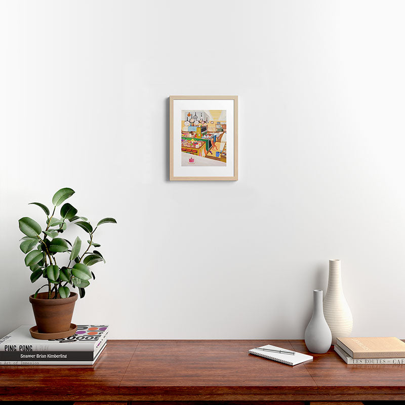 A Cat in the Kitchen Framed Art Print