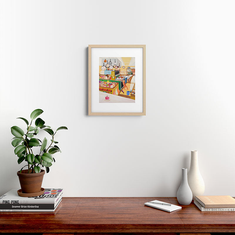 A Cat in the Kitchen Framed Art Print
