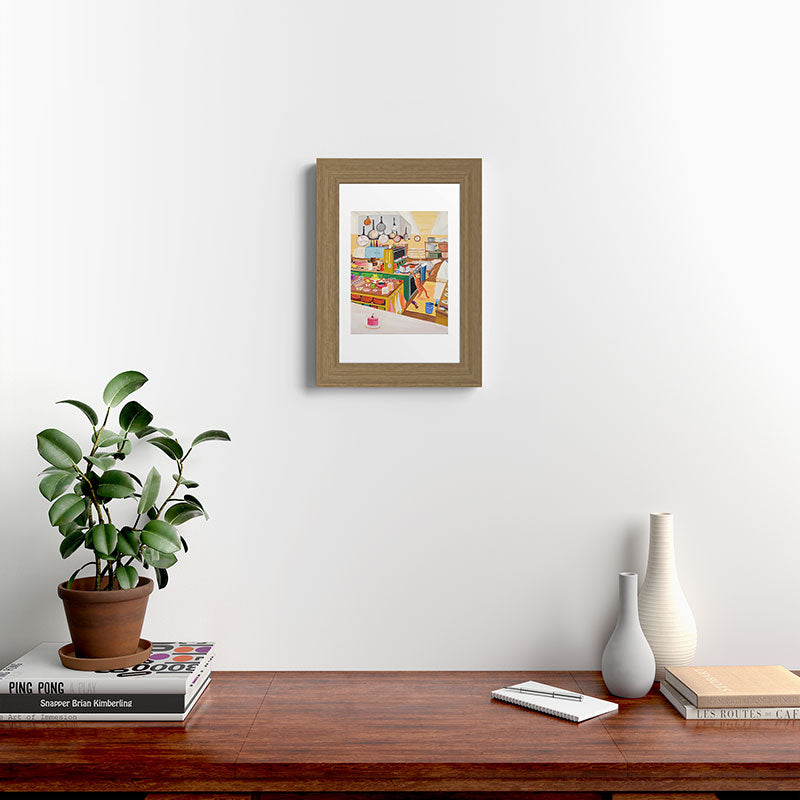 A Cat in the Kitchen Framed Art Print