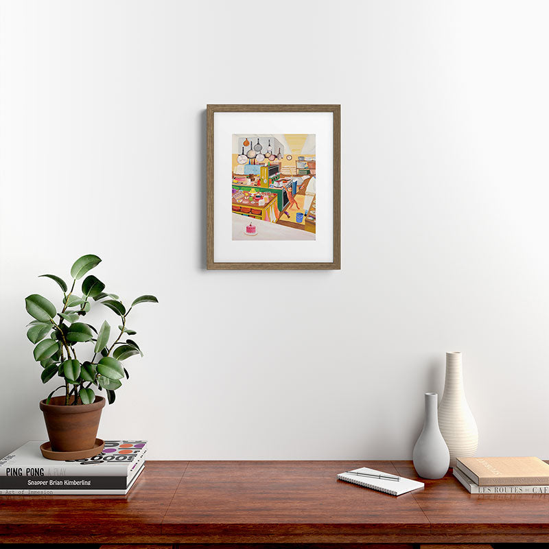 A Cat in the Kitchen Framed Art Print