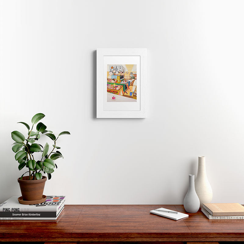 A Cat in the Kitchen Framed Art Print