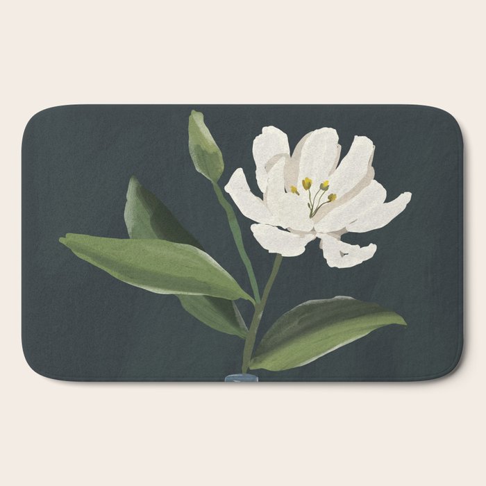 A flower in a vase Bath Mat