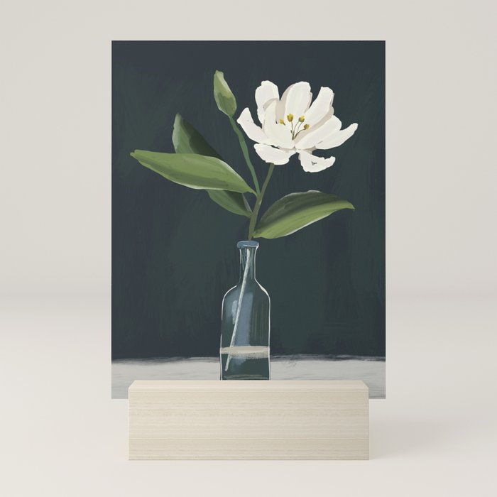 A flower in a vase Mini Art Print