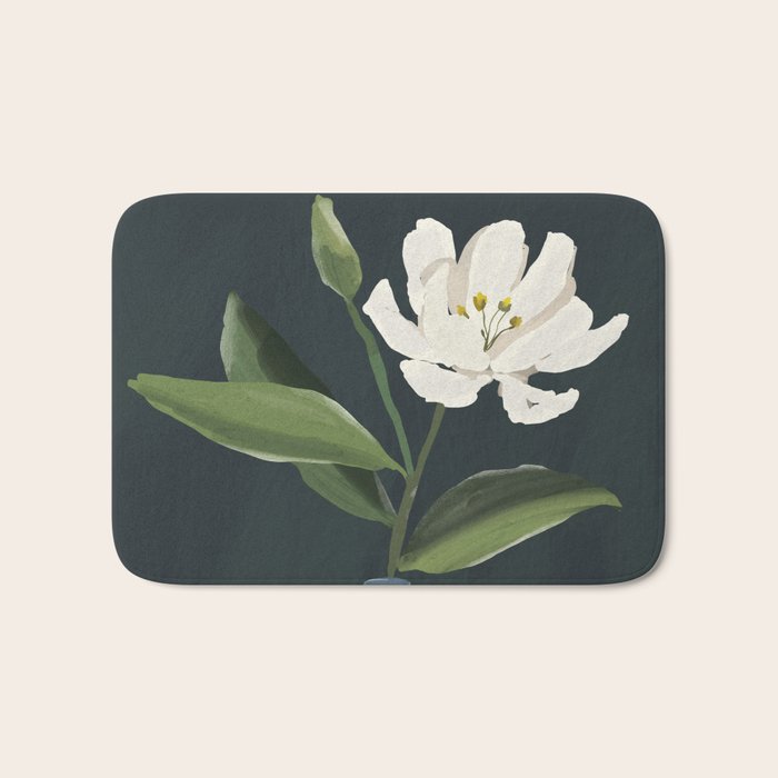 A flower in a vase Bath Mat