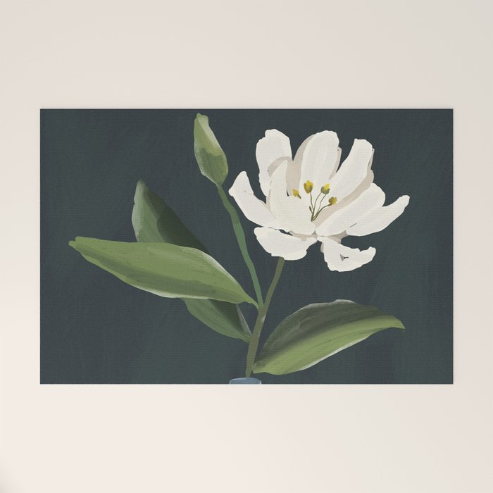 A flower in a vase Welcome Mat