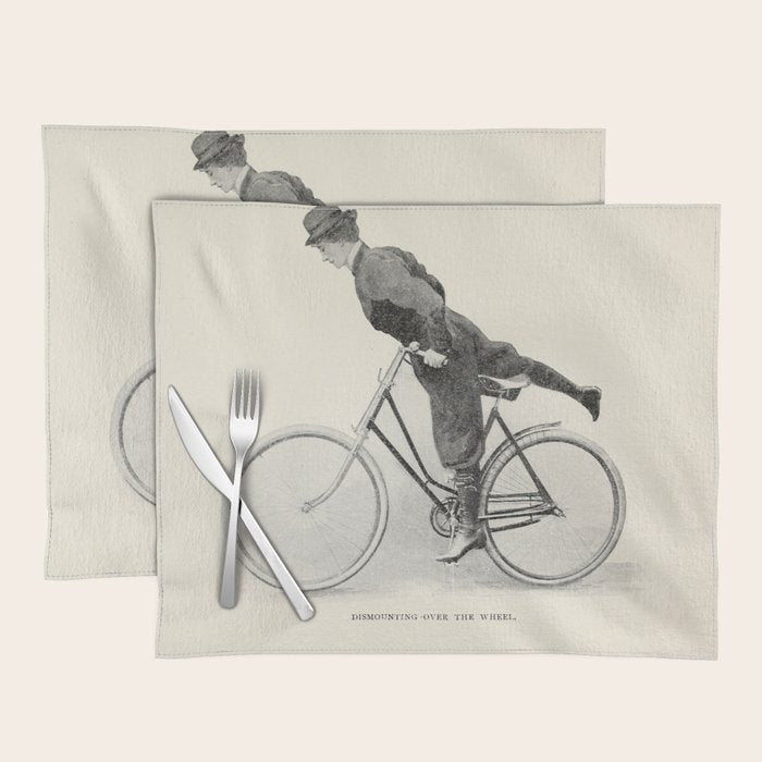 "Dismounting Over the Wheel" from "Bicycling for Ladies" by Maria E. Ward, 1896 Placemat