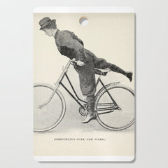"Dismounting Over the Wheel" from "Bicycling for Ladies" by Maria E. Ward, 1896 Cutting Board